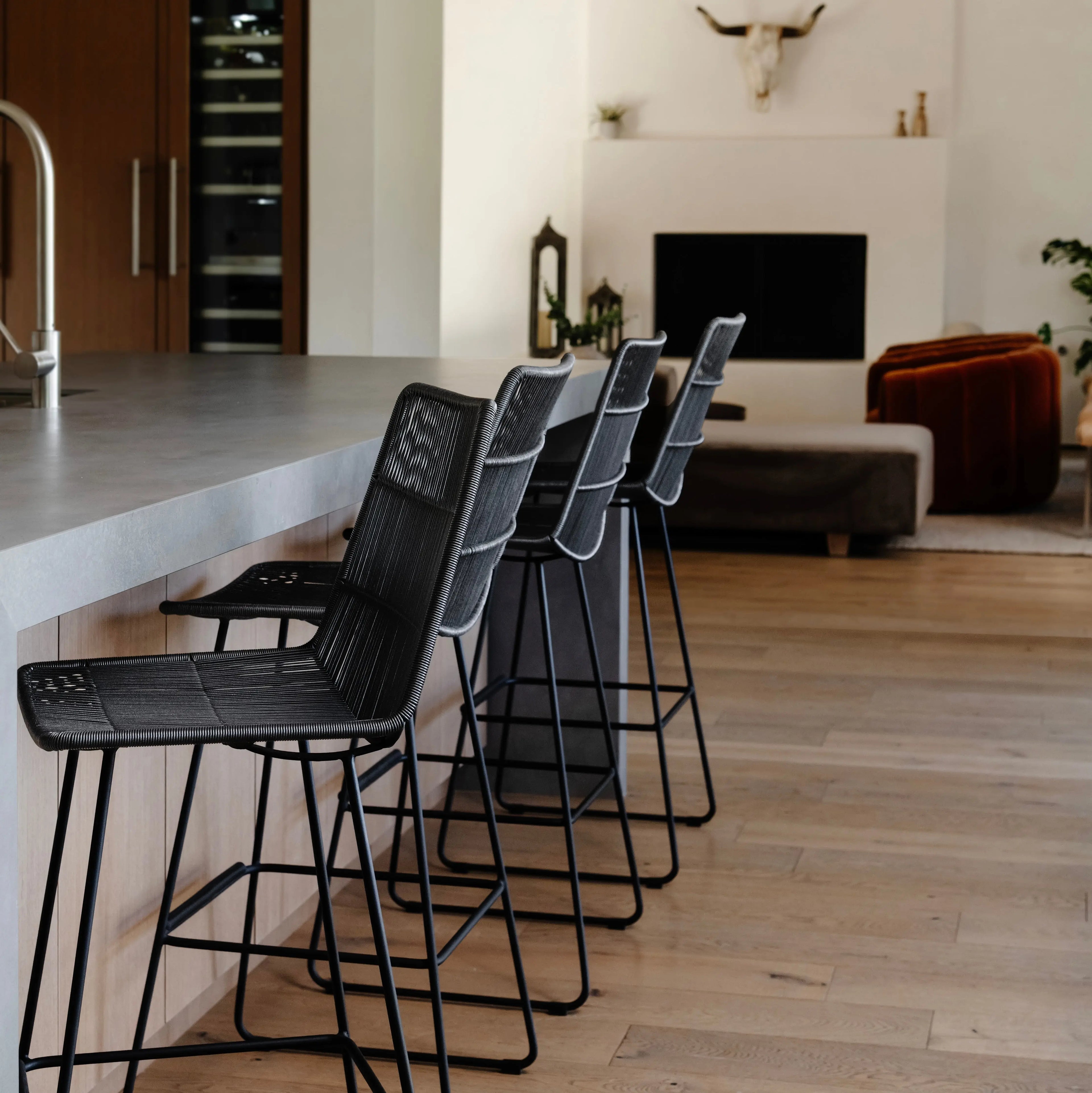 Black bar height chairs at kitchen island