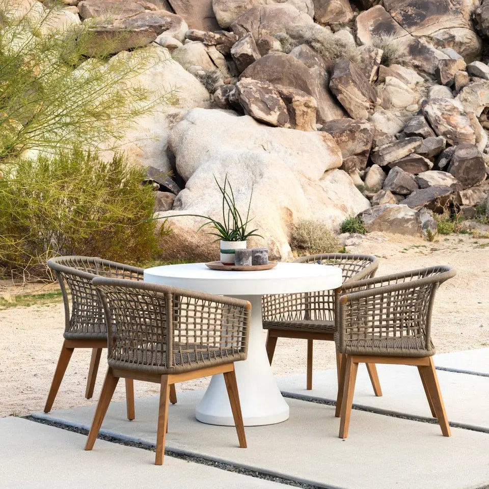 Outdoor patio bar set with white table and wicker chairs