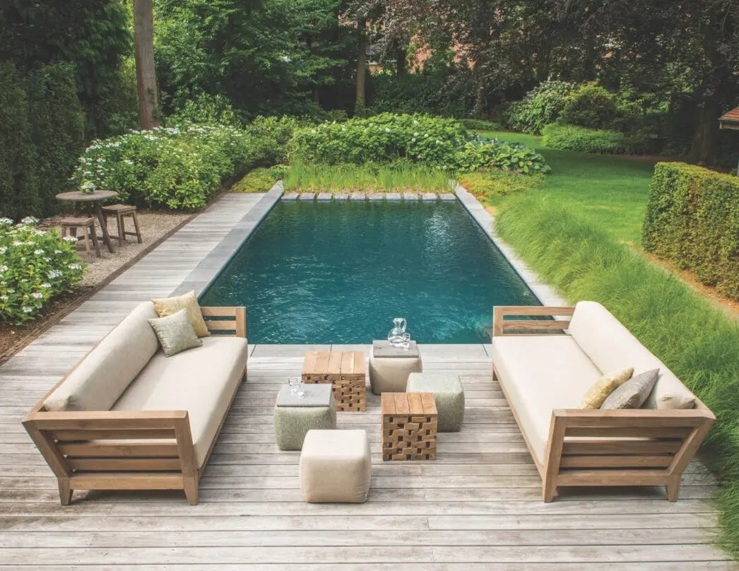 Small wooden outdoor side tables by pool