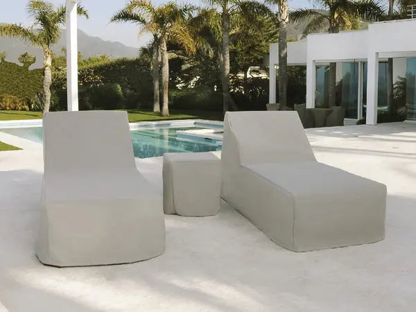 Weather-resistant outdoor furniture covers on lounge chairs