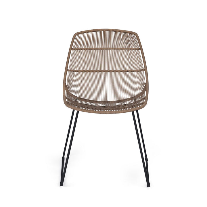 A brown woven chair with slender black metal legs is positioned on a plain white background, emphasizing its modern design and airy structure.