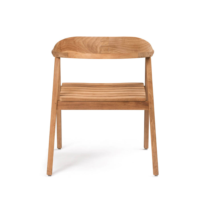 A wooden chair features a curved backrest and slatted seat, standing on four angled legs. It is positioned against a plain white background, highlighting its minimalist design.