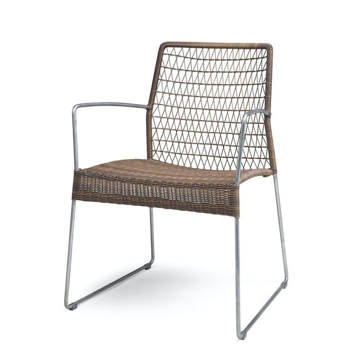 A wicker and metal chair with a lattice back sits on a white background, featuring a simple, modern design with armrests for comfort.