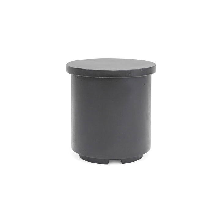 A cylindrical, dark gray stool stands on a white background, featuring a smooth, flat top and a simple design with subtle, sturdy footings.