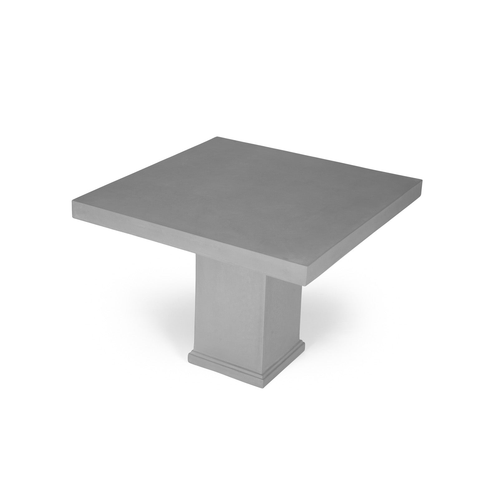 A square, gray concrete table sits on a single, thick pedestal base against a white background, highlighting its sleek, minimalist design.