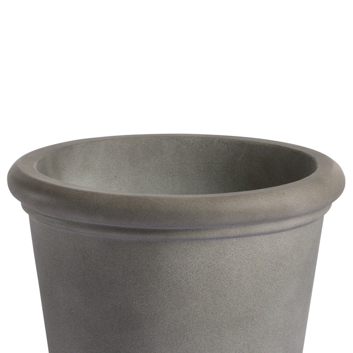 A gray, cylindrical flower pot with a thick, rounded rim stands empty, isolated against a white background.