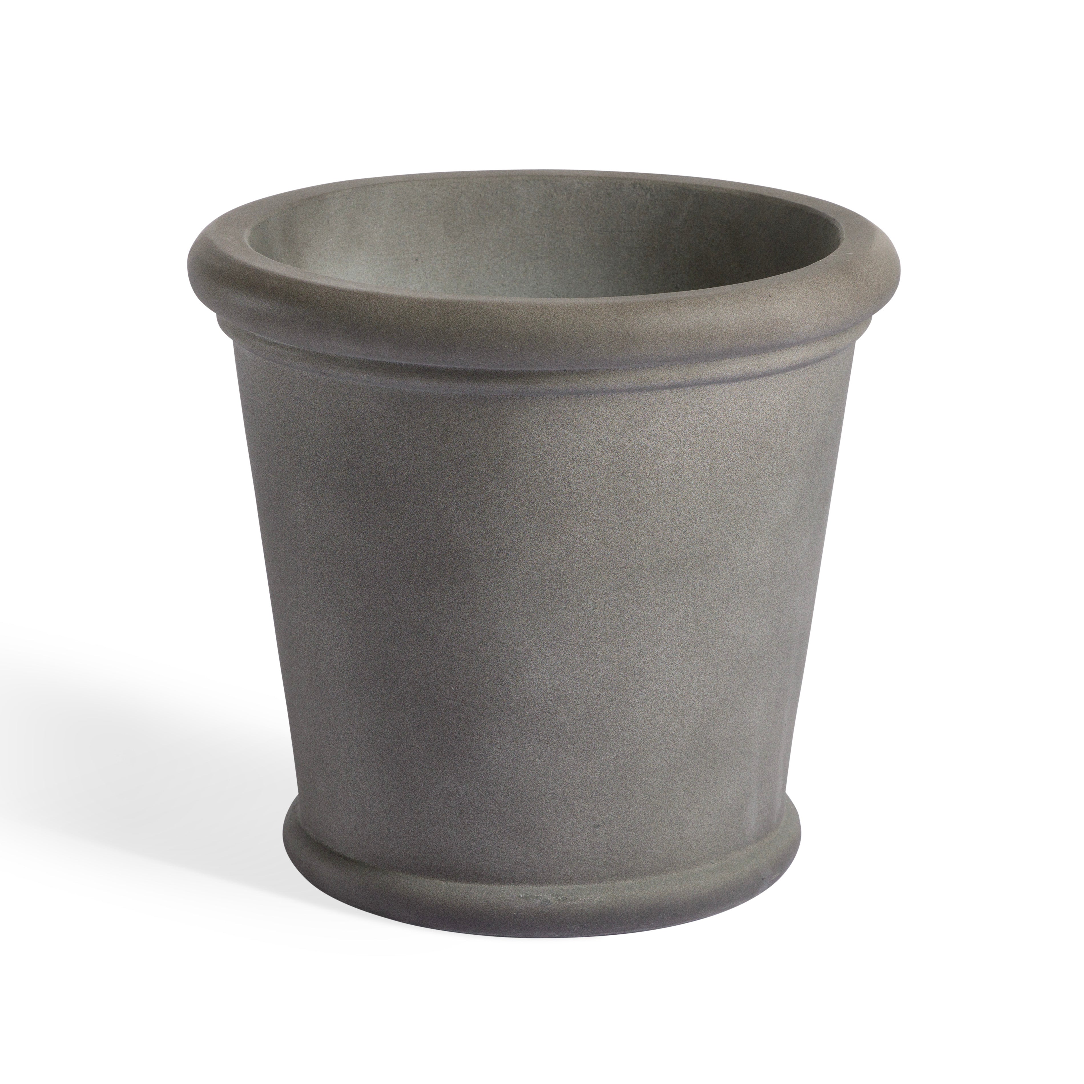 A gray, cylindrical flower pot with a flared rim stands on a plain white surface, casting a subtle shadow.