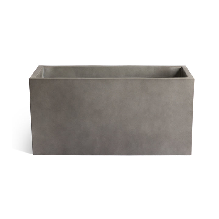 A rectangular gray concrete planter sits empty against a plain white background, showcasing its simple, modern design.