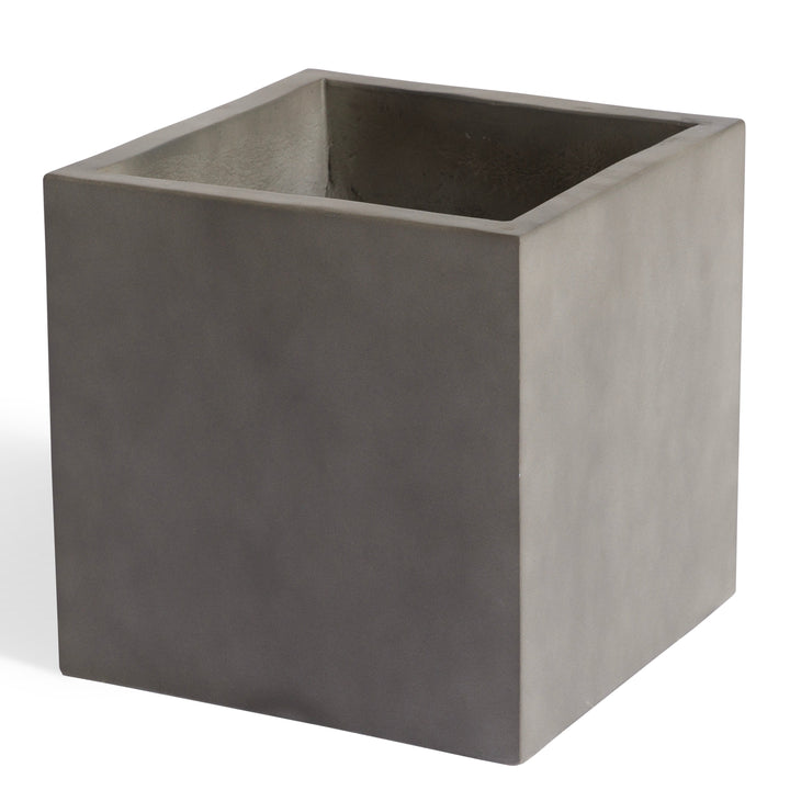 A gray, square planter sits empty, displaying smooth surfaces and sharp edges against a plain white background.