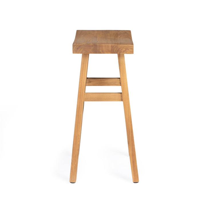 A wooden stool stands on four legs with a square seat and two crossbars for support, set against a white background.