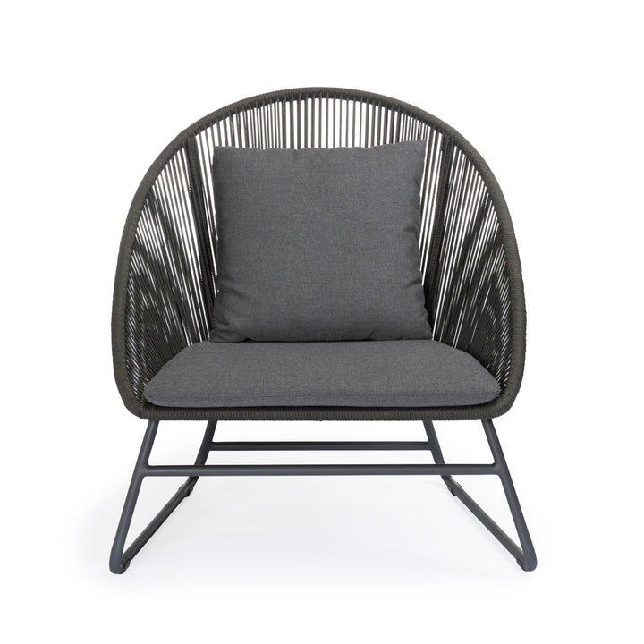 A modern chair with gray cushions rests on a metal frame, featuring a rounded back with string design, placed in a minimalist studio setting against a white background.