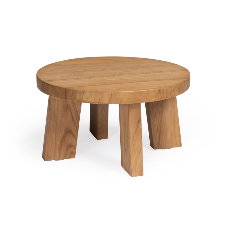 A round wooden table with a smooth surface sits on four wide, angled legs. The table is situated against a plain white background, highlighting its natural wood finish.