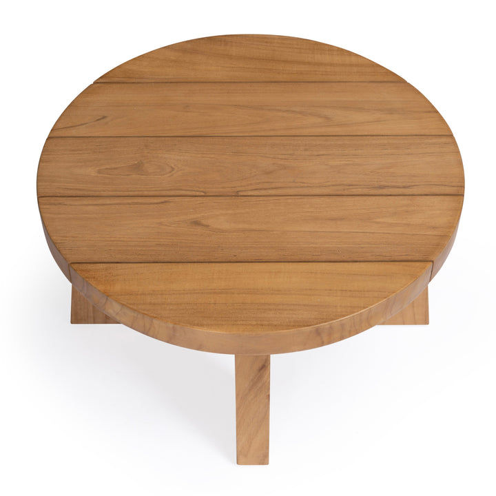 A round wooden table with a plank top and simple legs sits on a white background, demonstrating a minimalist design style.