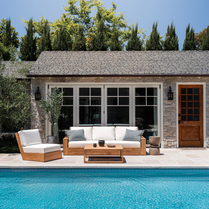 Kuba teak outdoor sofa with cushions by pool