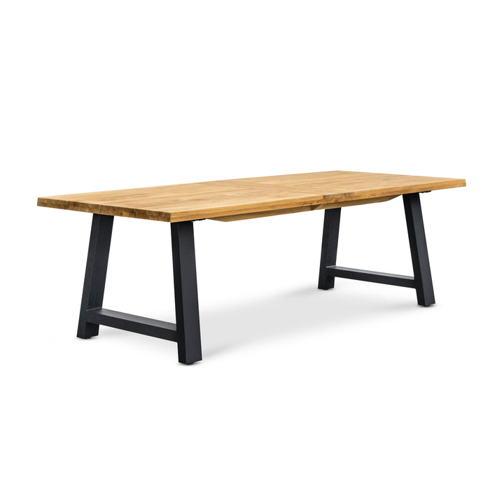 A wooden dining table features a smooth, rectangular top supported by sturdy black metal legs. It stands isolated on a white background, highlighting its minimalist, modern design.