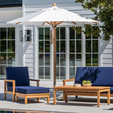 Outdoor patio set with blue cushions by a poolside