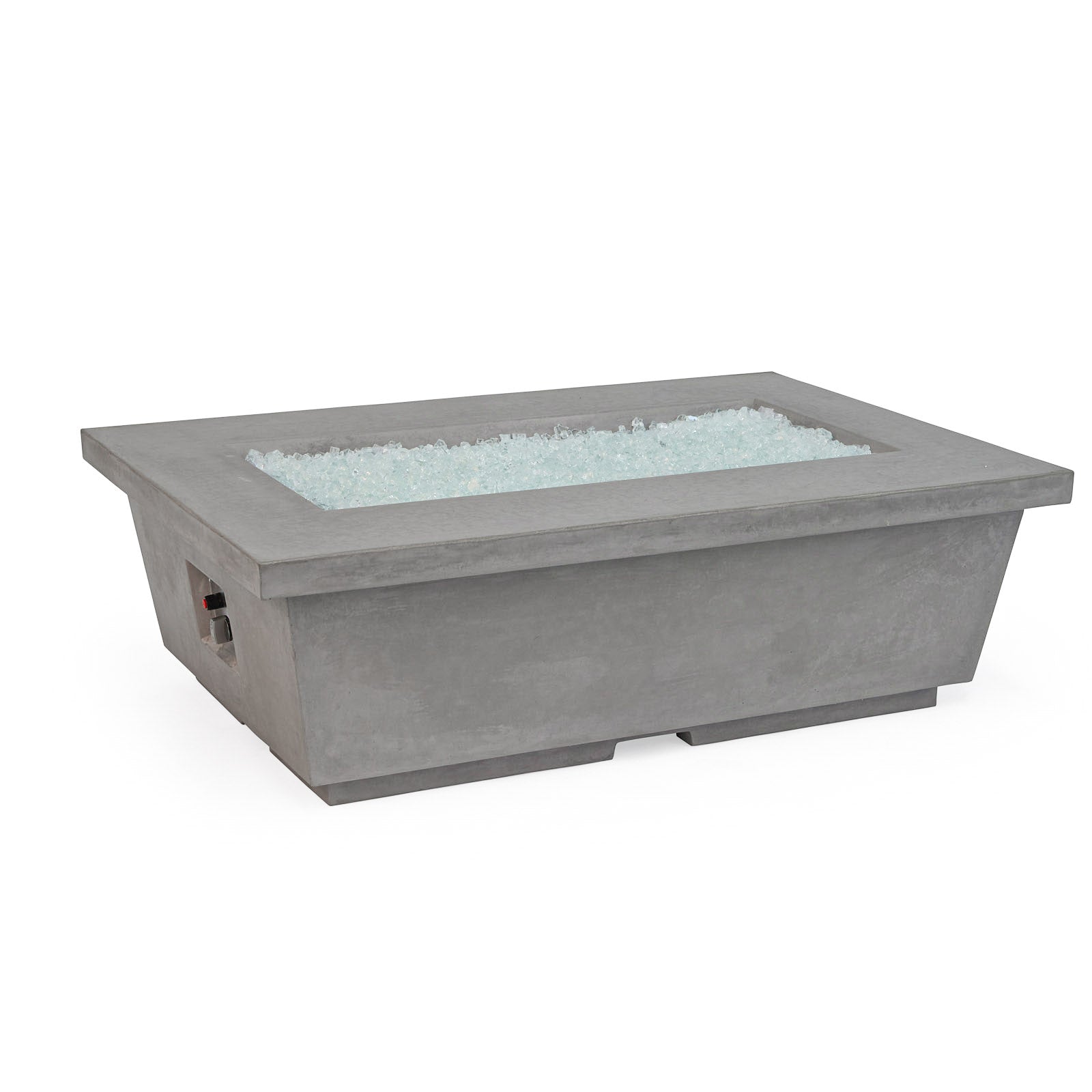 A rectangular, gray concrete fire pit filled with clear glass pebbles, sits on a white background. A control dial is visible on the side.