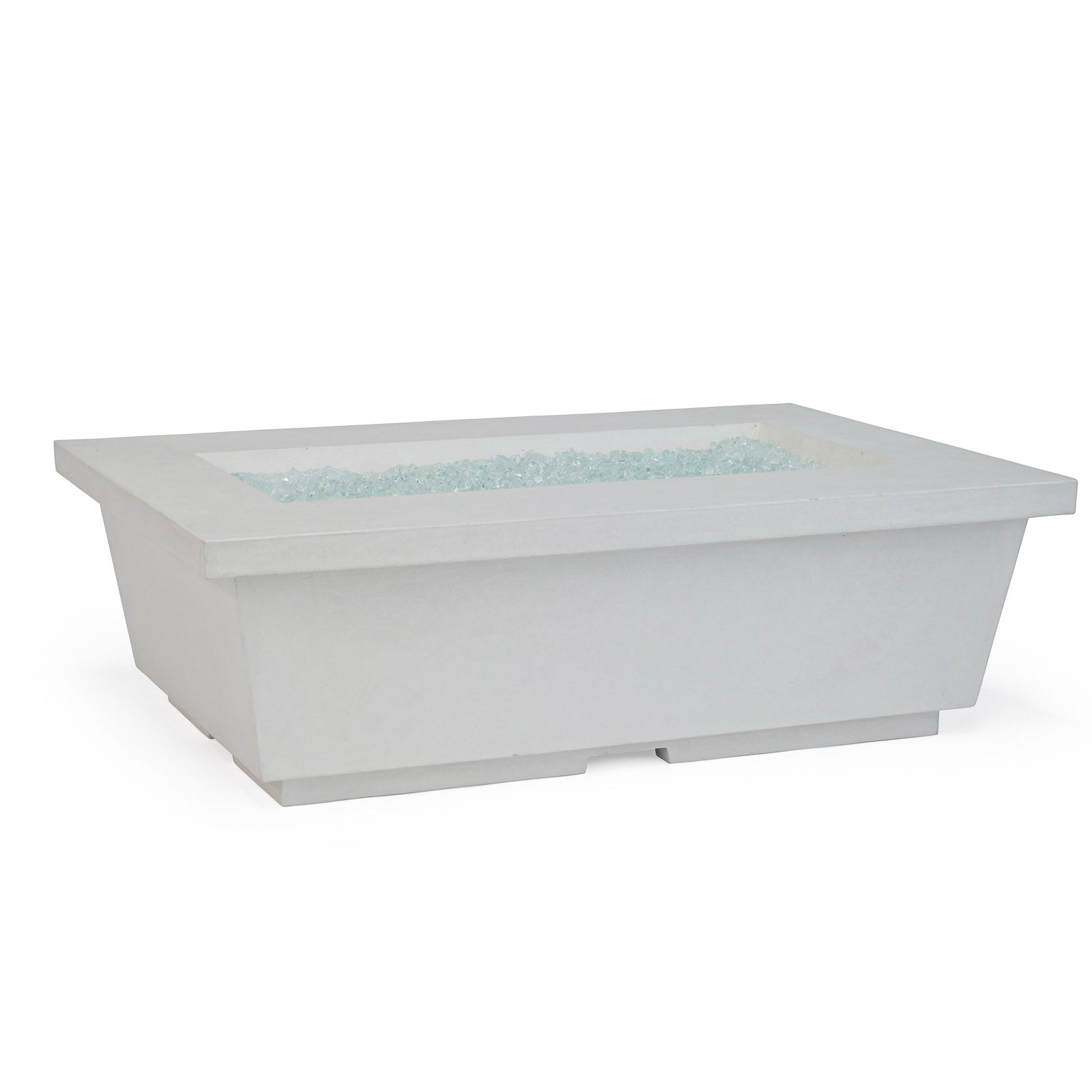 A rectangular, white fire pit sits on a white surface, containing clear, decorative glass pieces within its recessed top.