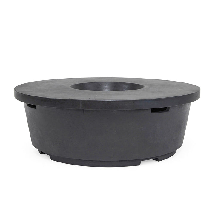 A round, black fire pit with a recessed center sits on a smooth white surface, featuring a minimalistic design suitable for outdoor settings.