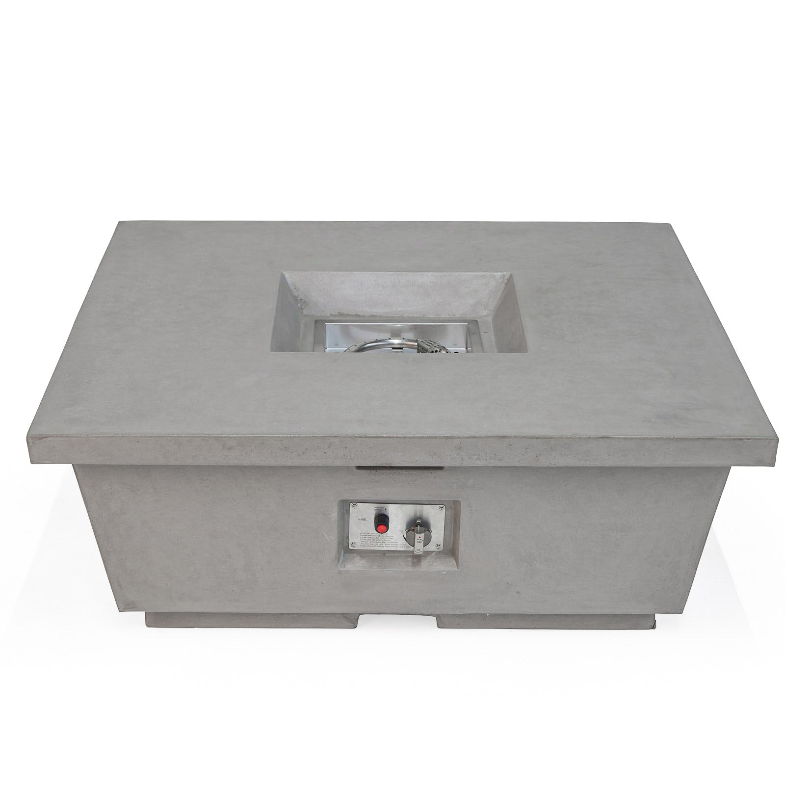 A gray rectangular fire pit sits unlit, with controls visible on the front panel. It features a recessed square area at the top, housed indoors.