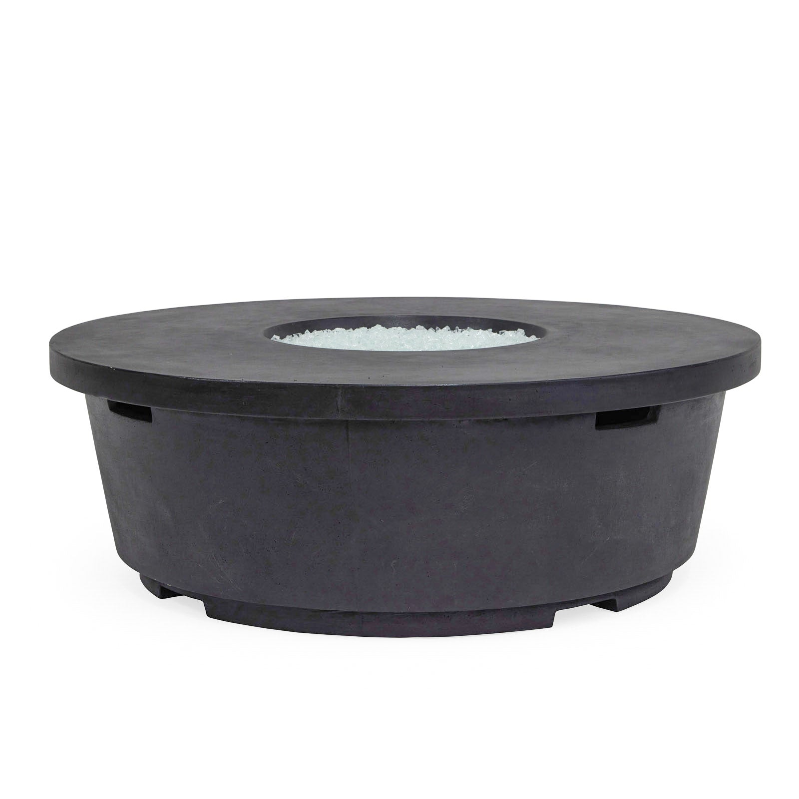 A round, black, concrete fire pit with a recessed center containing glass stones sits on a white background, emphasizing its sleek design and robust construction.