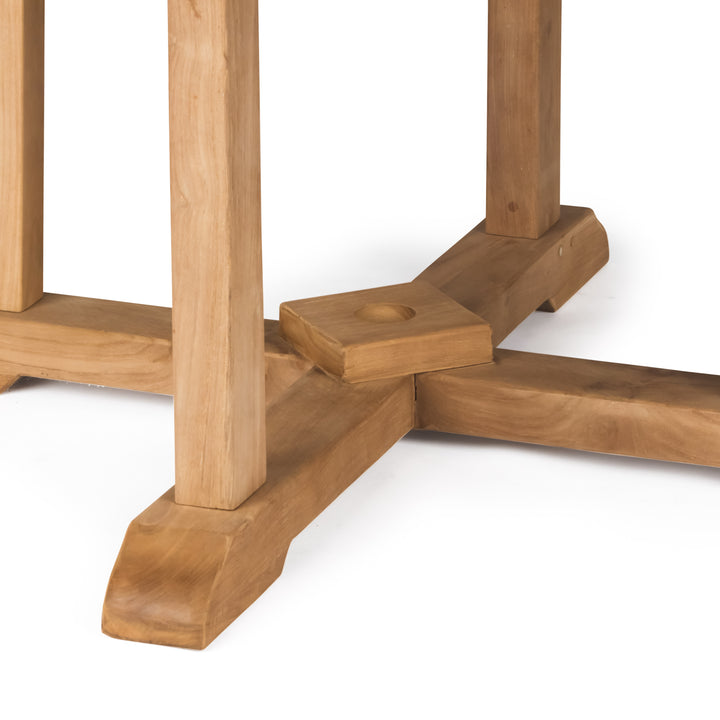 Wooden table base with four legs connected by cross-shaped supports, featuring a central circular indentation. The context suggests a sturdy construction on a smooth, light-colored surface.