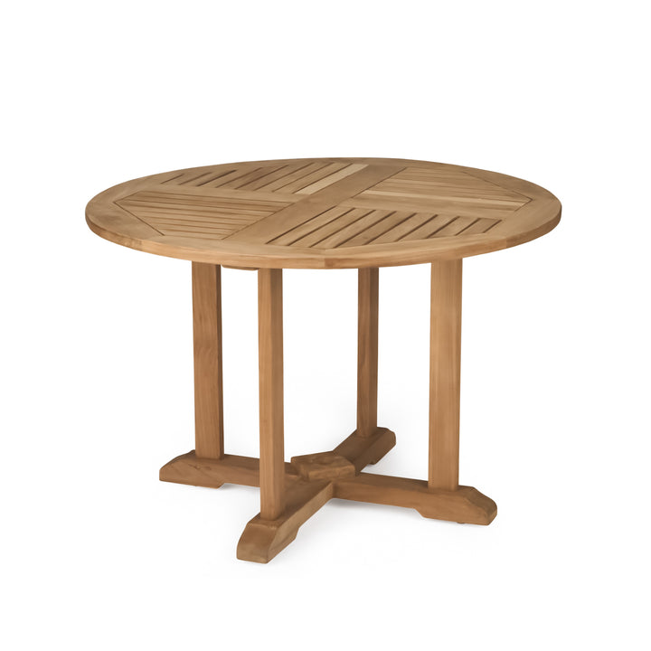 A round wooden table stands on a cross-shaped base with four legs, featuring a slatted design on its surface. The context is a plain, white background.