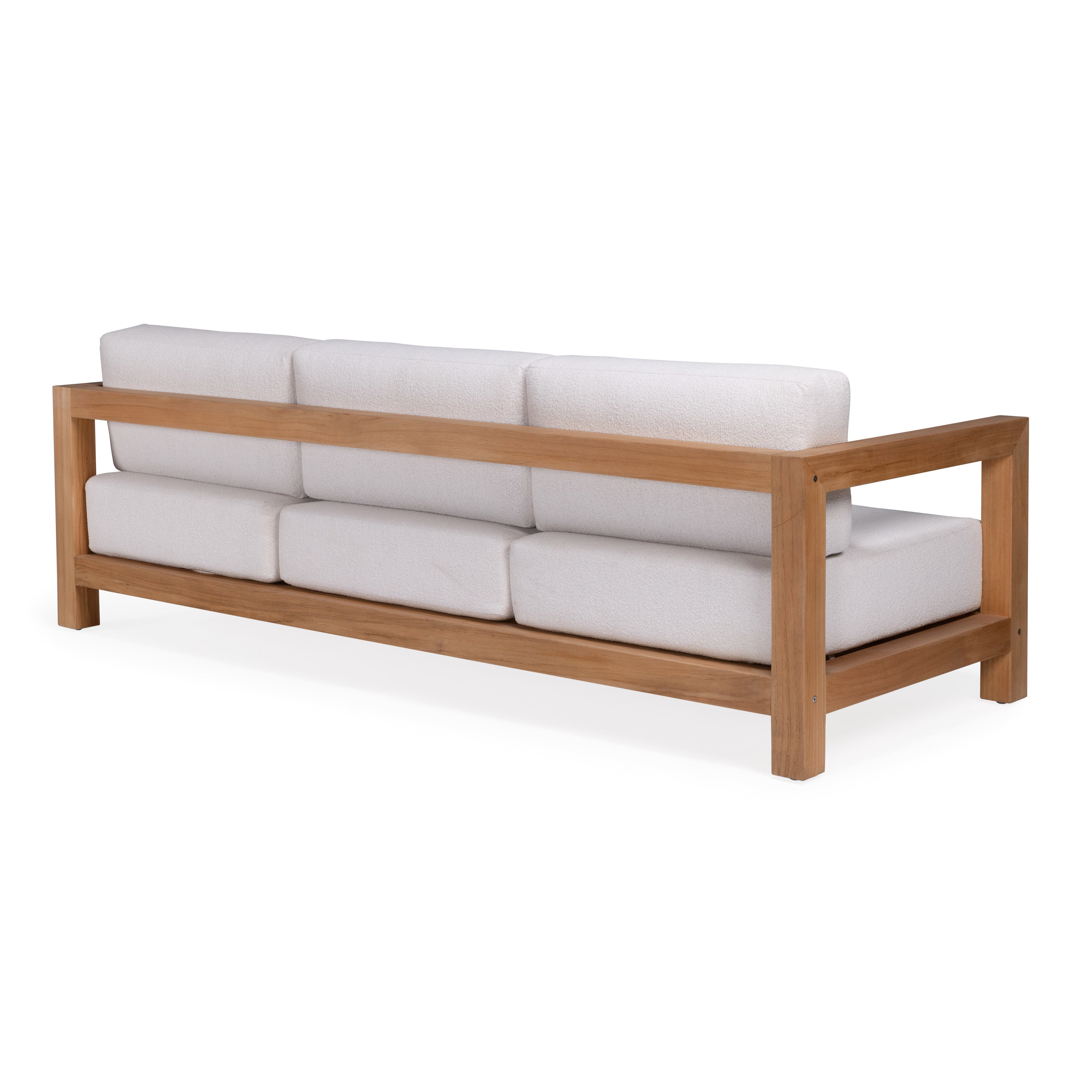 A wooden-framed sofa features white cushions aligned along the back and seat, positioned in a minimalistic, bright setting.