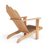 Adirondack Teak Outdoor Relaxing Chair set in a beautiful outdoor patio, demonstrating its elegance and suitability for luxurious lounging.