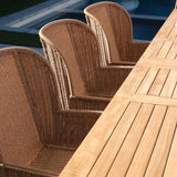 Georgia Wicker Outdoor Dining Arm Chair in Honey paired with an outdoor dining table, creating an inviting and sophisticated dining atmosphere.