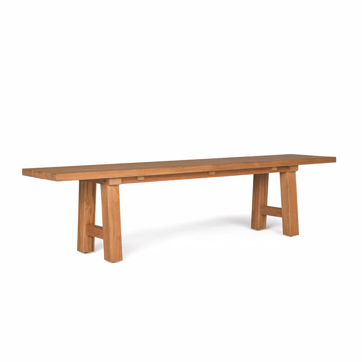 Wooden bench stands on two sturdy legs, extending horizontally in a minimalist design; surrounded by a plain white background.