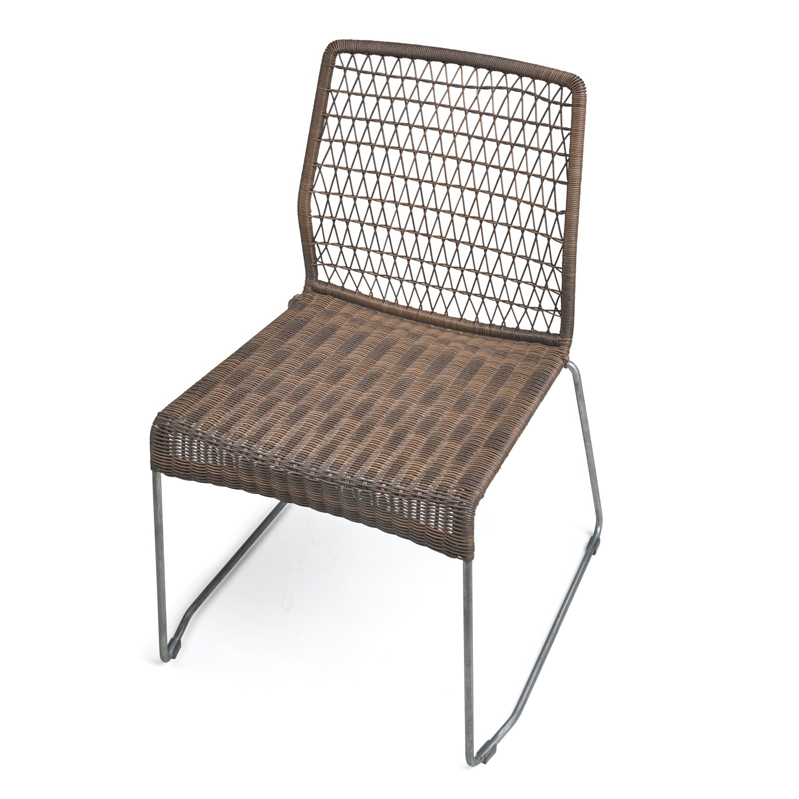 A wicker chair with a patterned backrest is resting on metal legs in a plain, white background.