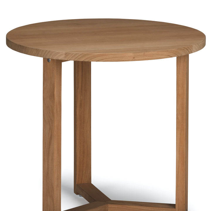 A round wooden table resting on three vertical legs, situated on a plain white background.