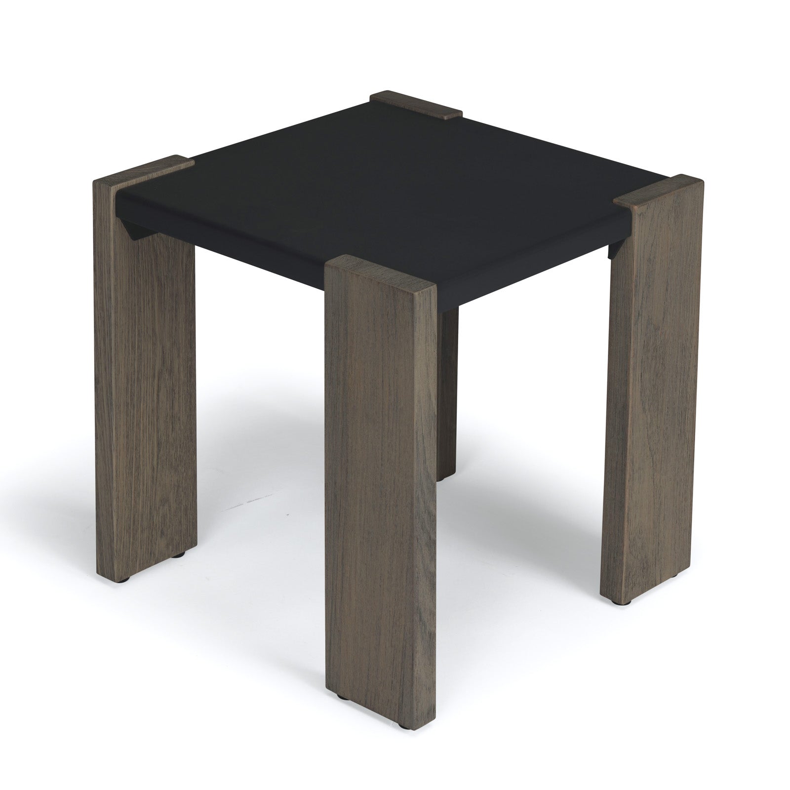 A small, square, dark tabletop rests on four sturdy, light wooden legs, set on a plain white background.