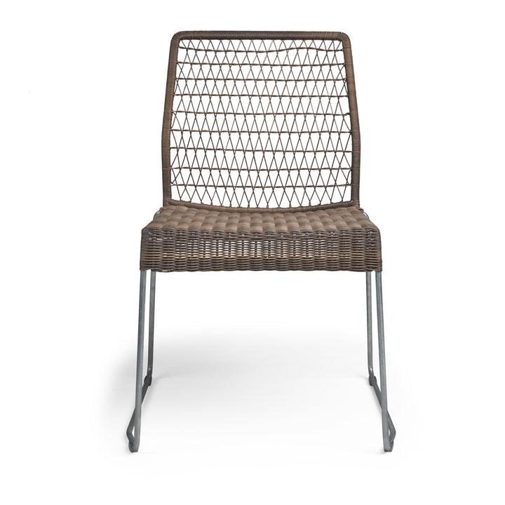 A wicker chair with a diamond-patterned backrest and woven seat stands on metal legs, set against a plain white background.