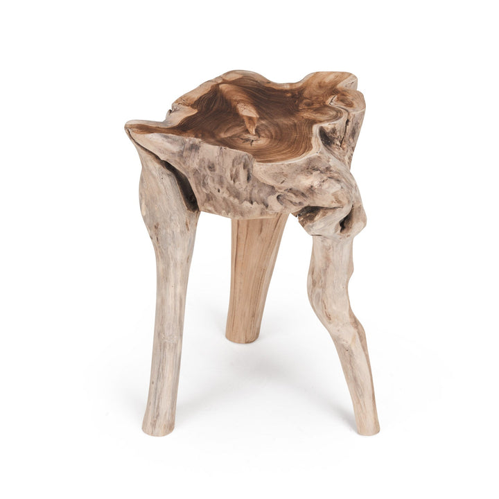 A wooden stool, sculpted with a natural, rustic design, stands on three irregular legs. It has a uniquely contoured, textured surface. The background is plain white.