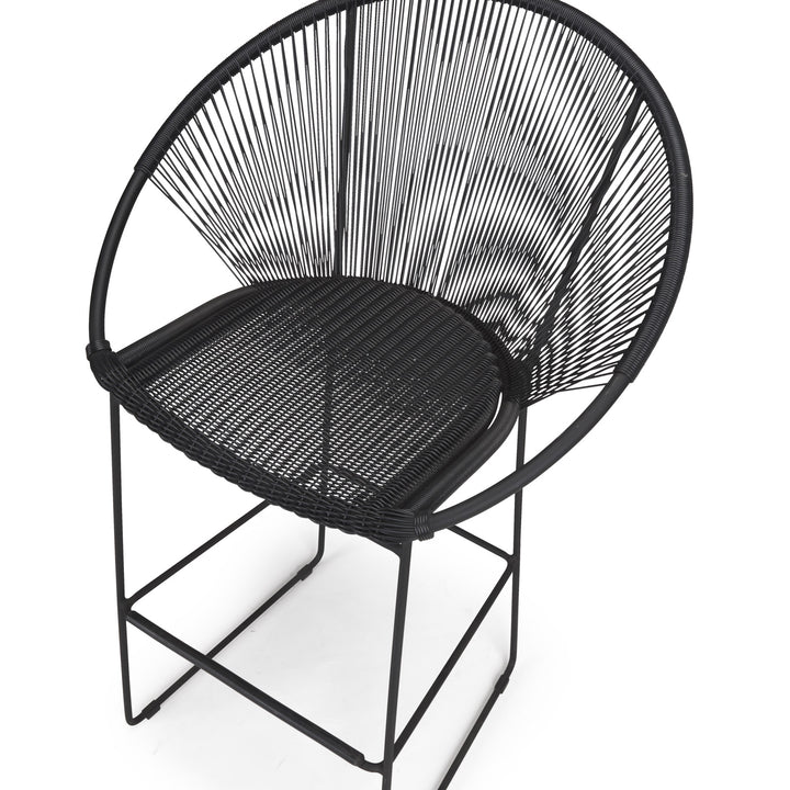 A black, wire-framed chair with a woven seat and back, set against a plain white background.