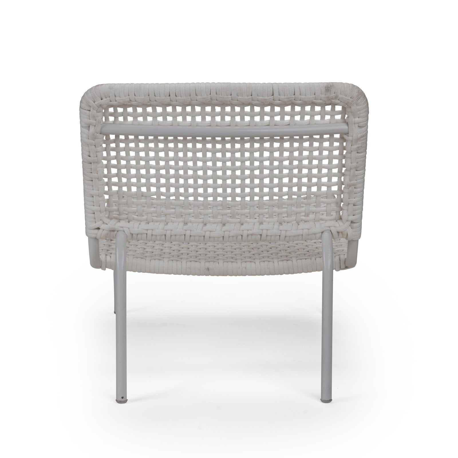 A white woven chair stands with its back visible, featuring a grid pattern and supported by metal legs, set against a plain white background.