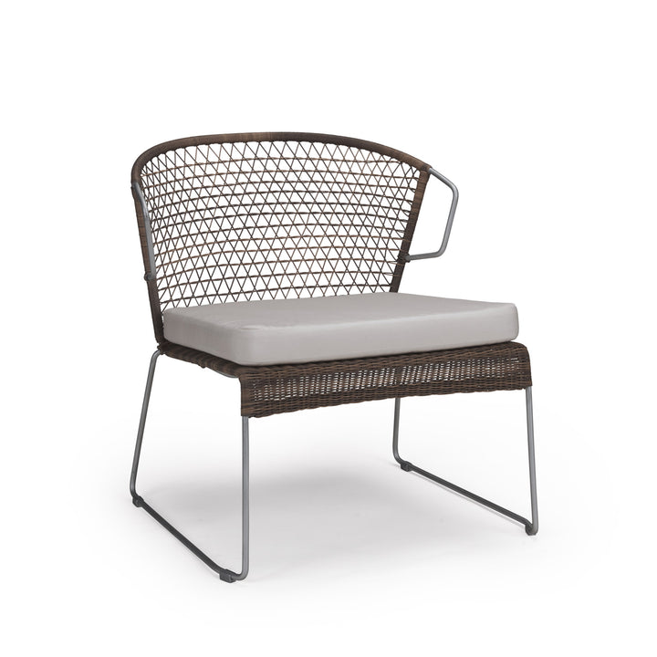 A brown wicker chair with a triangular mesh backrest and a cushioned seat sits on metal legs, isolated on a white background.