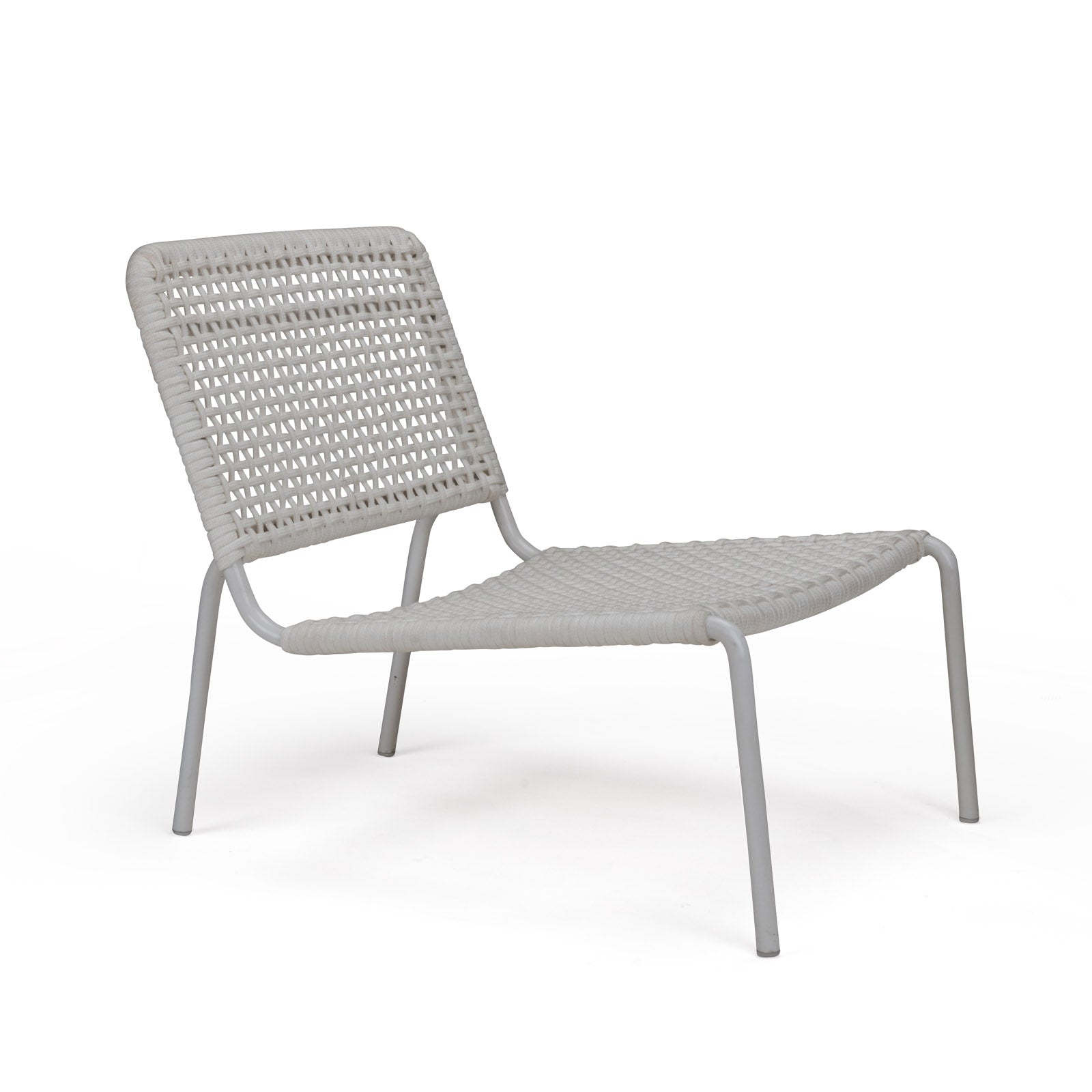 A white woven lounge chair is positioned at an angle on a plain white background, showcasing its minimalist design with a low, angled backrest and metal legs.