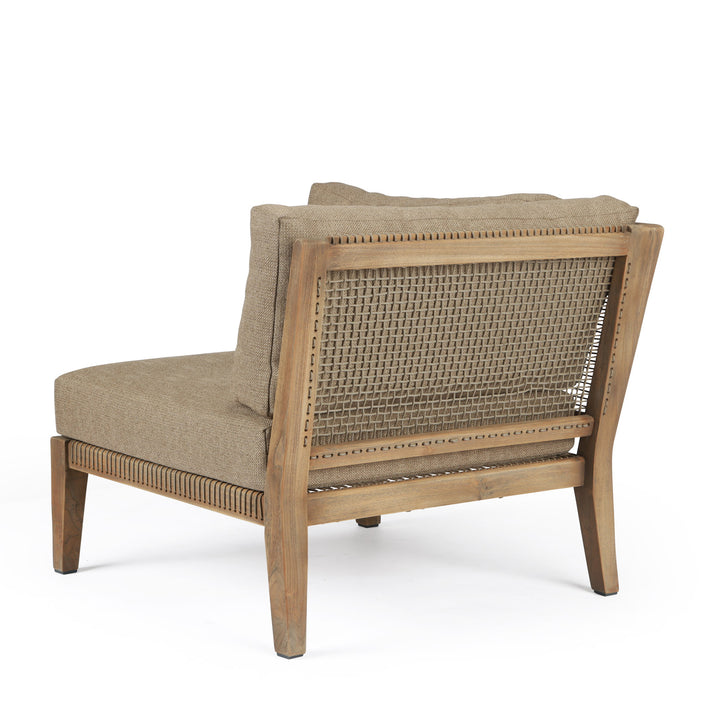 A cushioned armchair with beige fabric sits on a wooden frame featuring a woven rattan backrest, positioned against a plain white background.