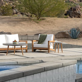 Large round concrete outdoor side table with teak legs