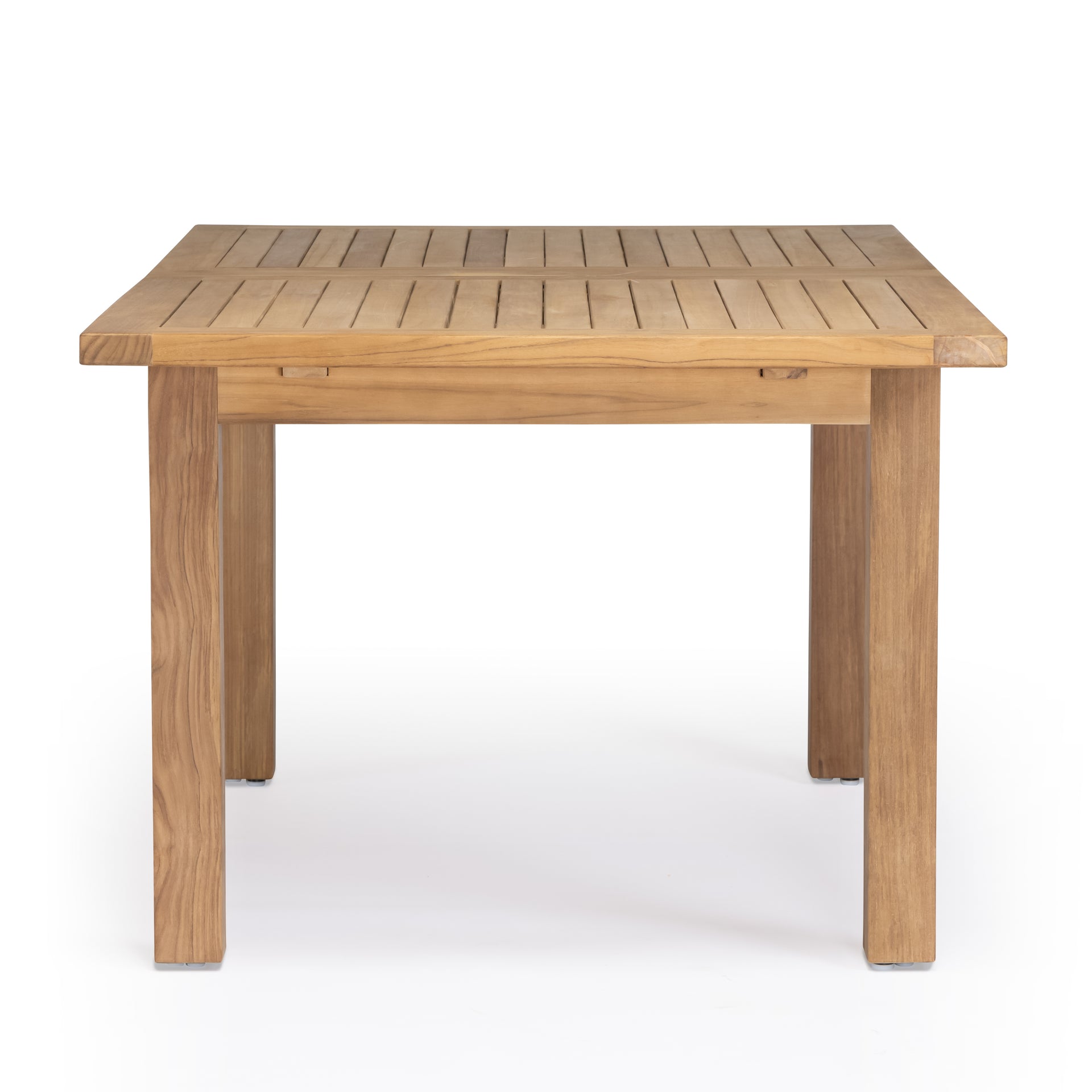 A sturdy, rectangular wooden table stands on four legs, featuring a slatted top. It is situated in a plain, white environment, emphasizing its natural wood grain.