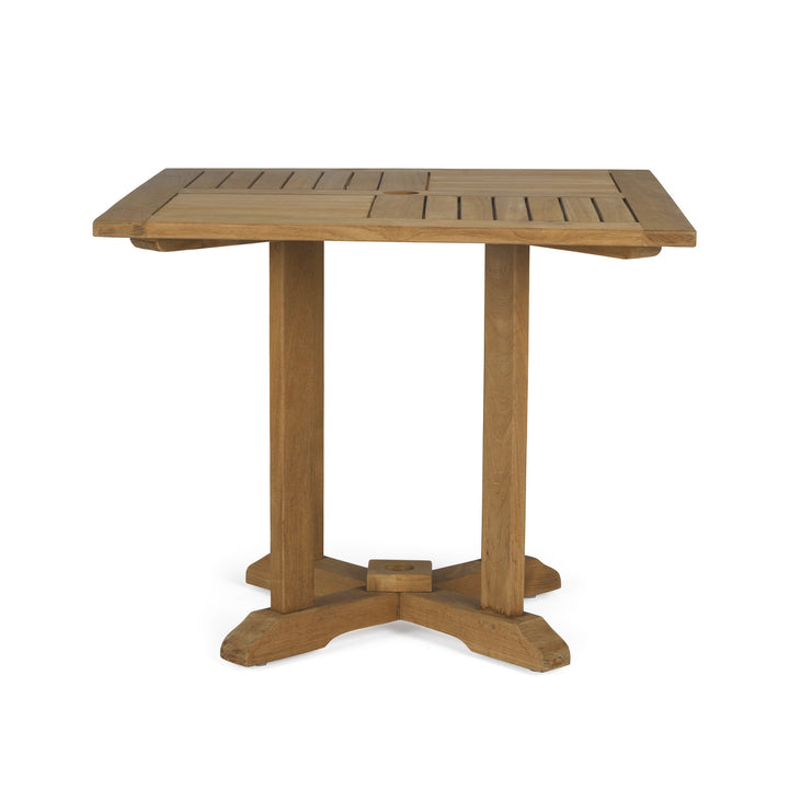 A wooden table with a slatted rectangular top sits on a cross-shaped base, positioned against a plain white background.