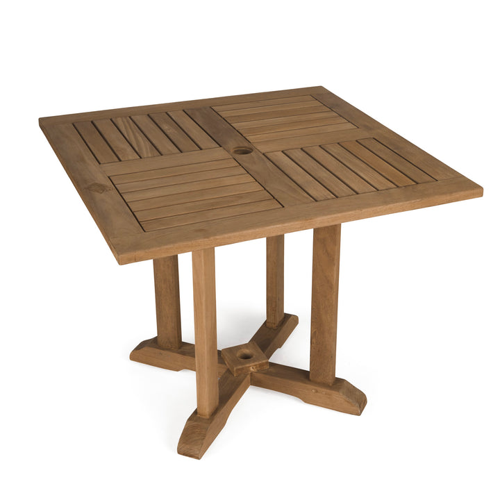 A square, wooden table with a slatted top and a hole in the center; supported by four sturdy legs connected at the base. No text is visible.