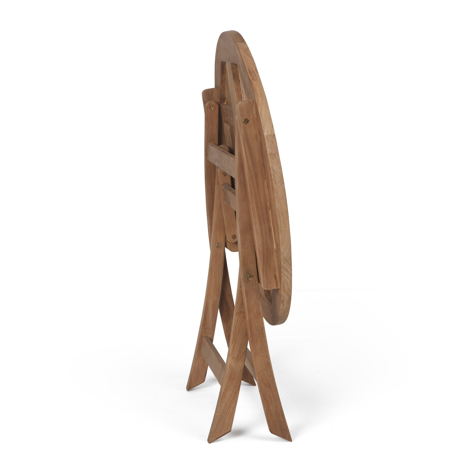 A wooden, circular tabletop is folded vertically on a collapsible, cross-legged stand, set against a plain white background, indicating a portable or storable piece of furniture.