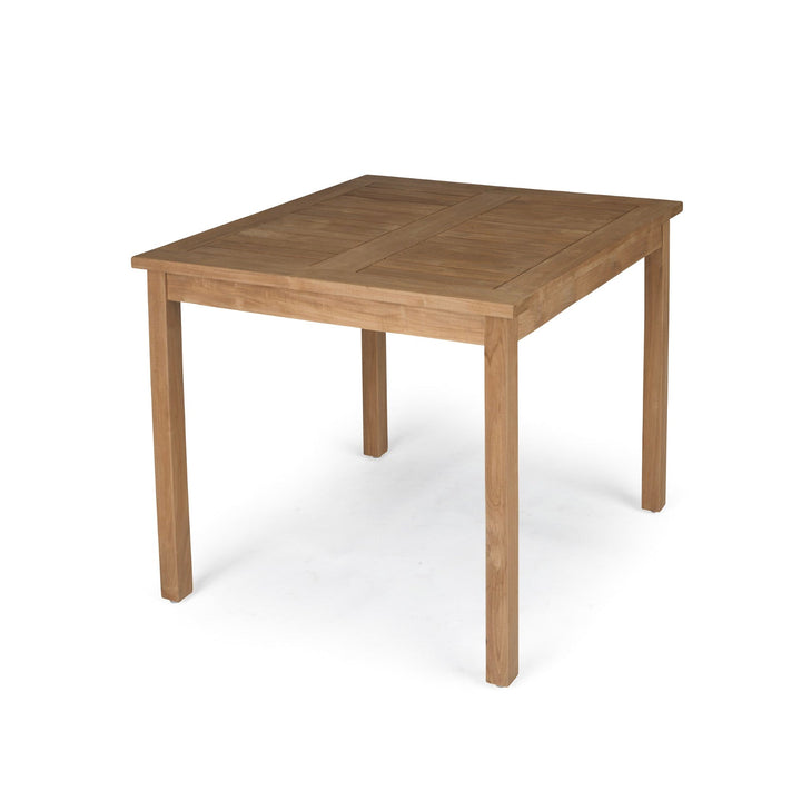 A square wooden table stands on four legs, featuring a simple, natural finish, positioned against a plain white background.