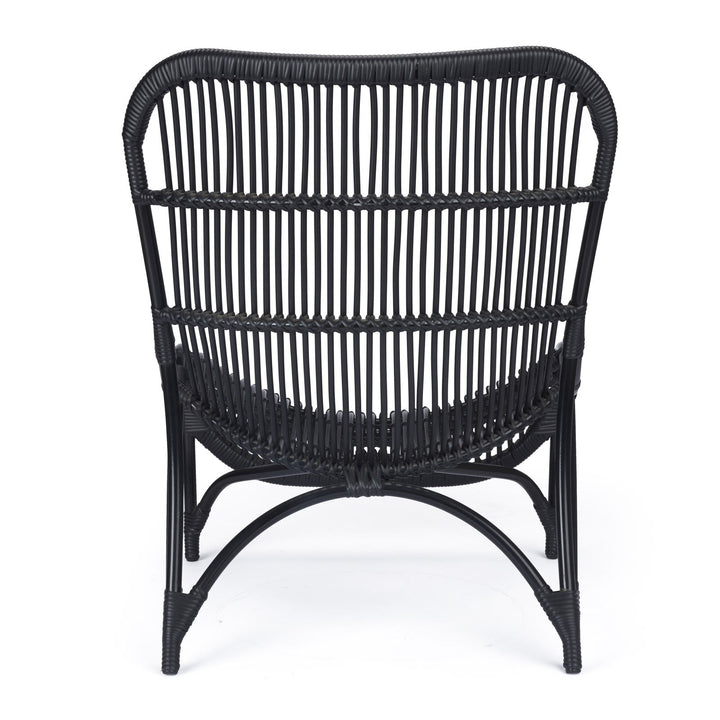 A black wicker chair stands upright, featuring an arched backrest composed of vertical, woven strands. The chair is set against a plain white background.