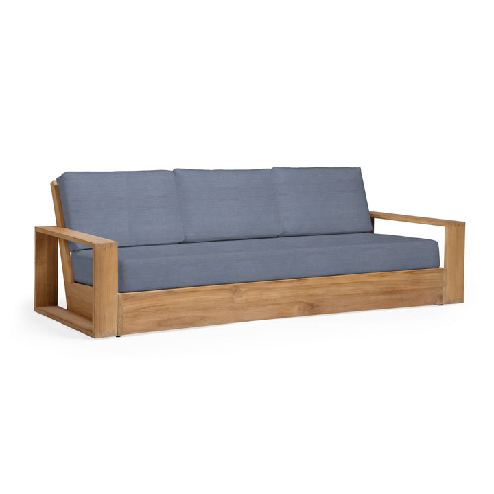 Wooden sofa with blue cushions on a white background