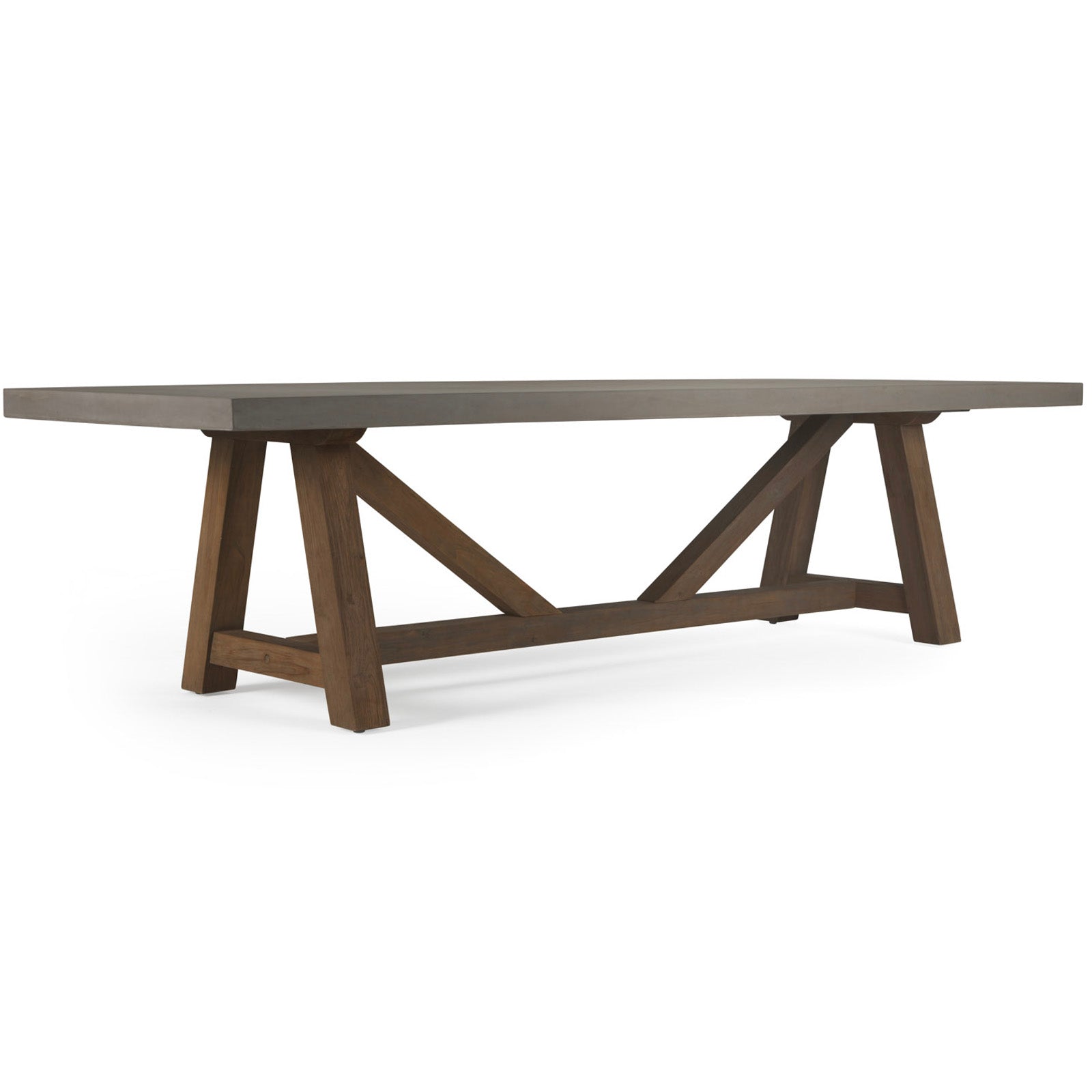 A rectangular table with a solid flat top and sturdy wooden trestle legs, positioned in a minimalist space with a white background.